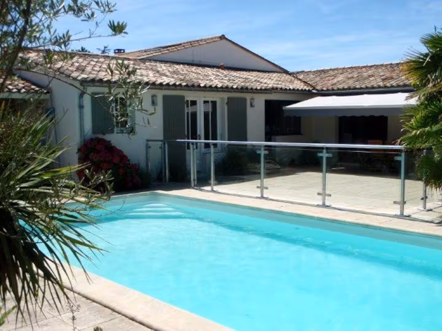 Pool and terrace with sunbeds